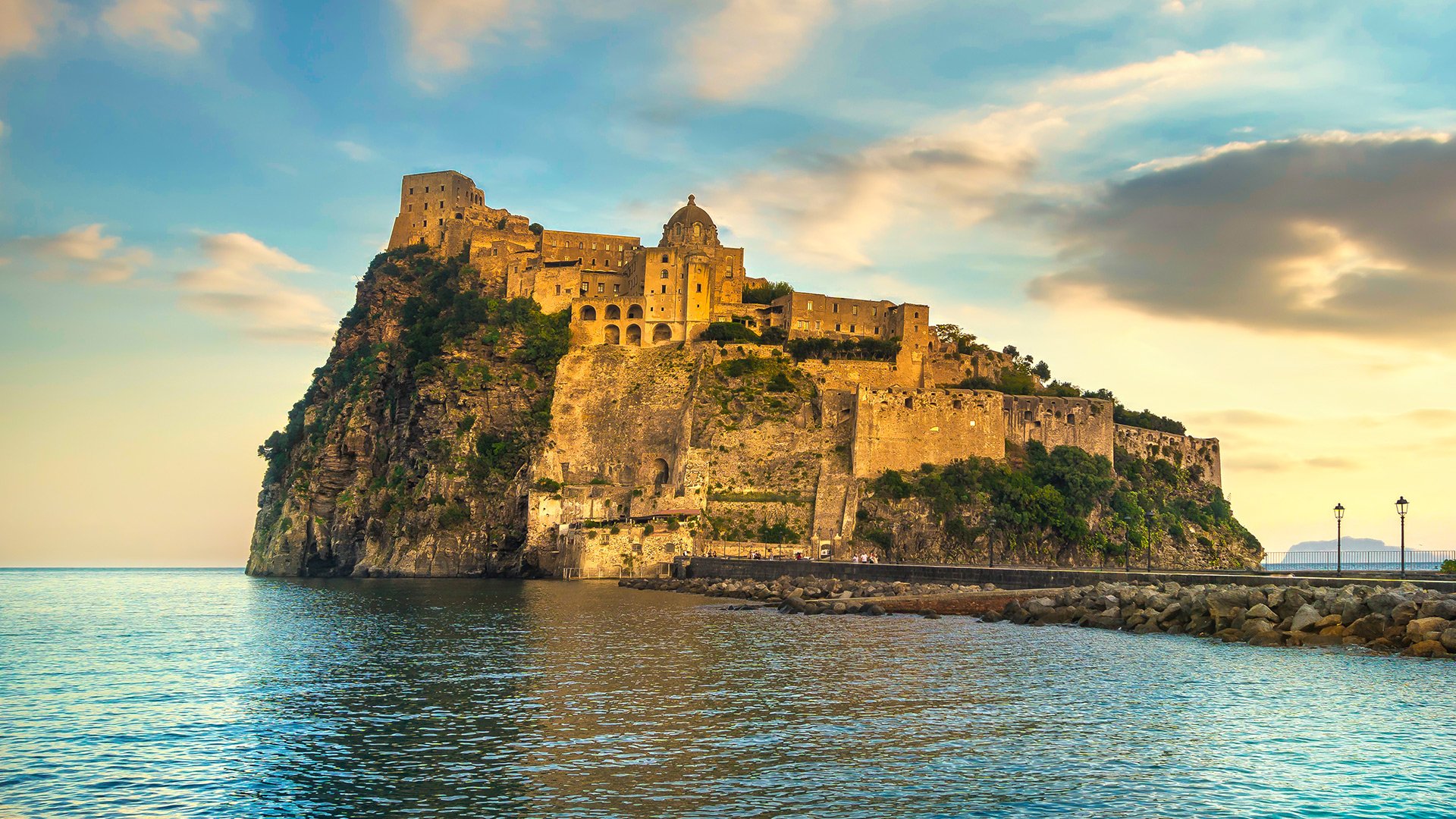 Ischia island and Aragonese medieval castle or Ischia Ponte. Travel destination near Naples in Campania, Italy. Europe.