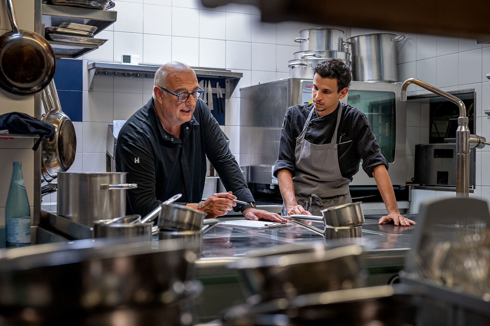 Chef Fenoglio and Chef Pattaro in the kitchen