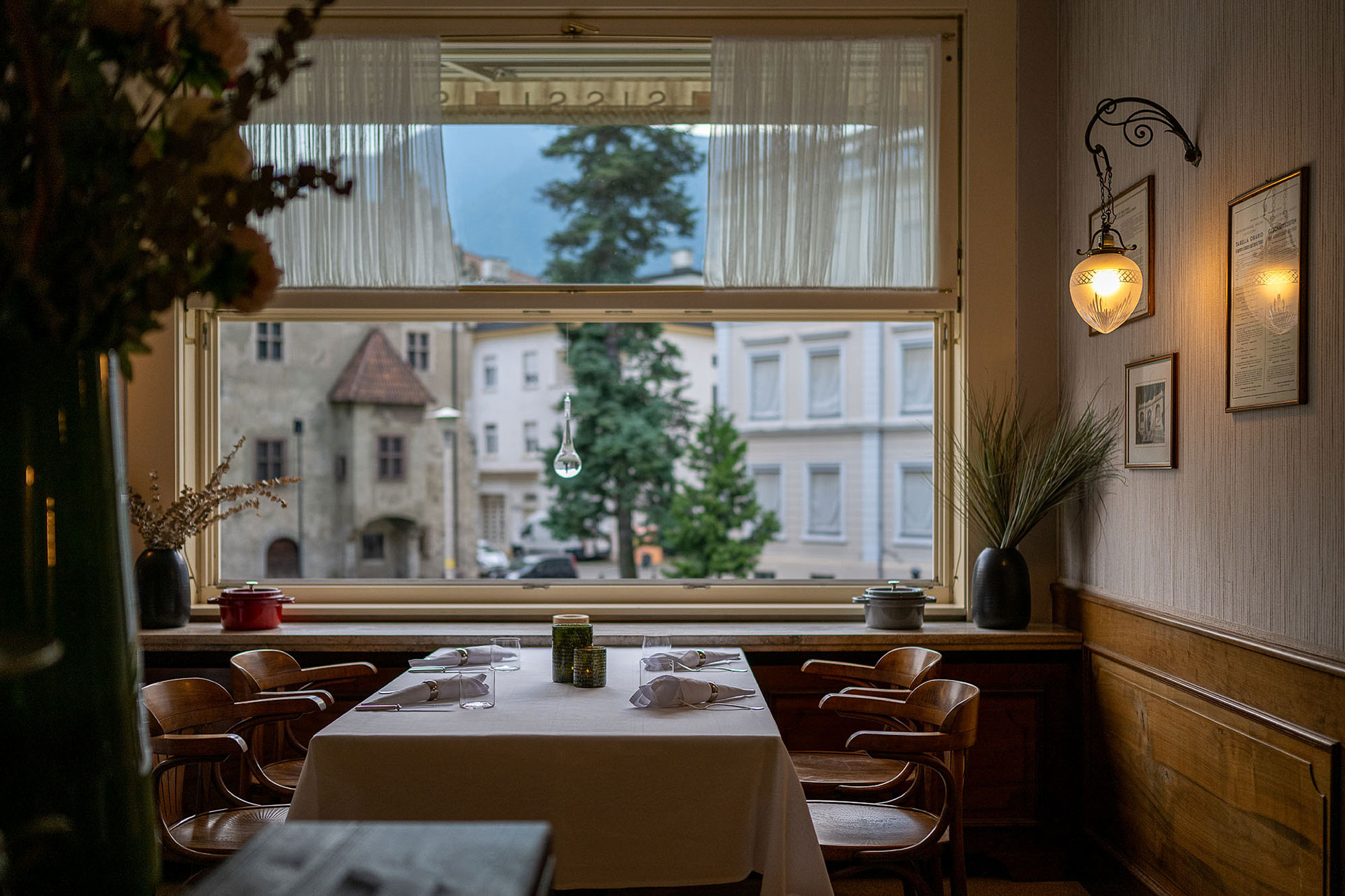 A table in the dining room of Restaurant Sissi overlooking Merano